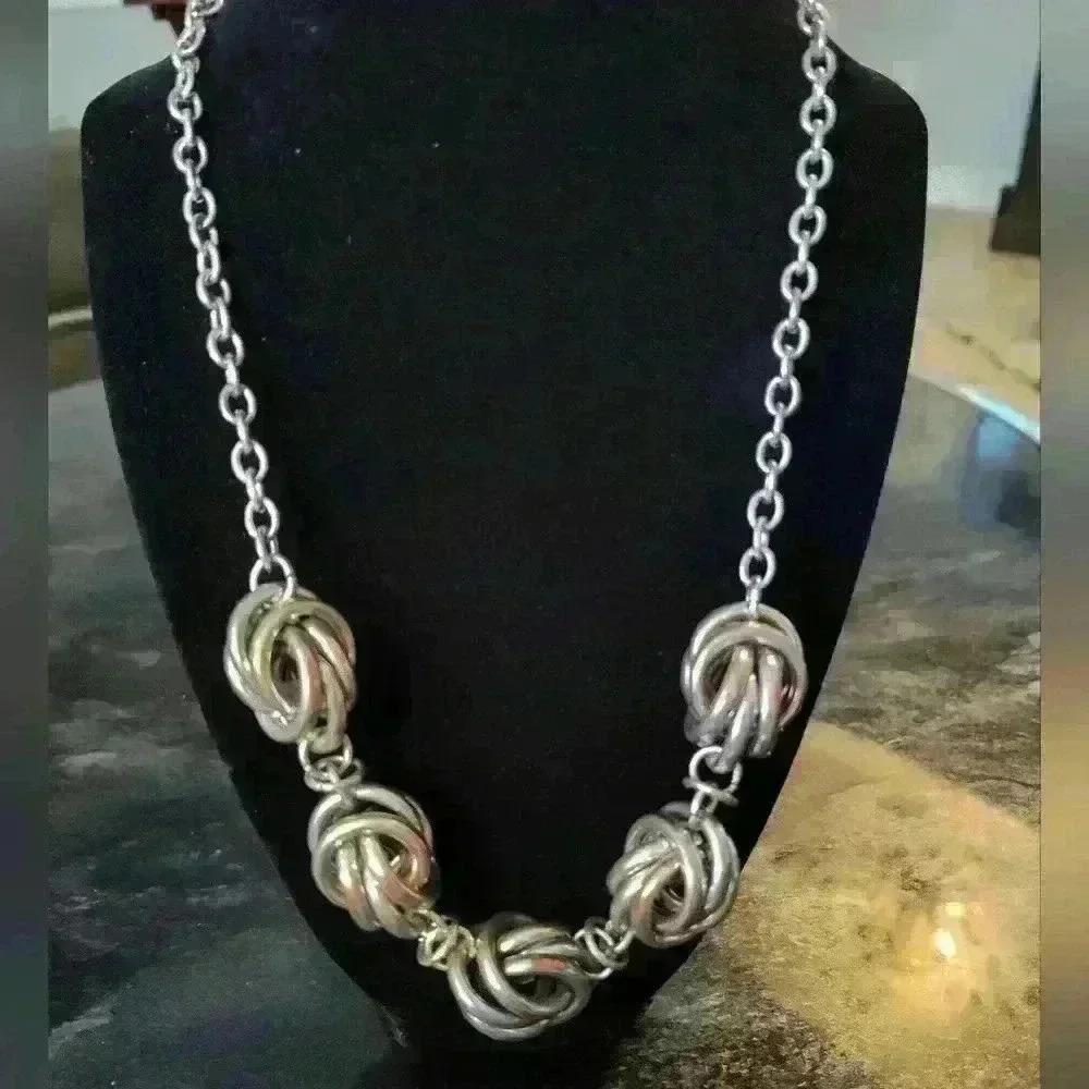 Plunder sliver tone knotted necklace
